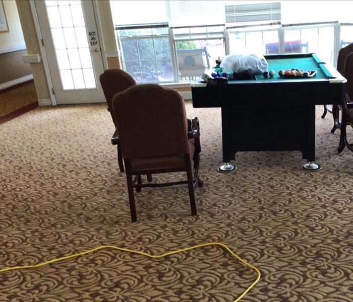 A restored activity room free of water damage