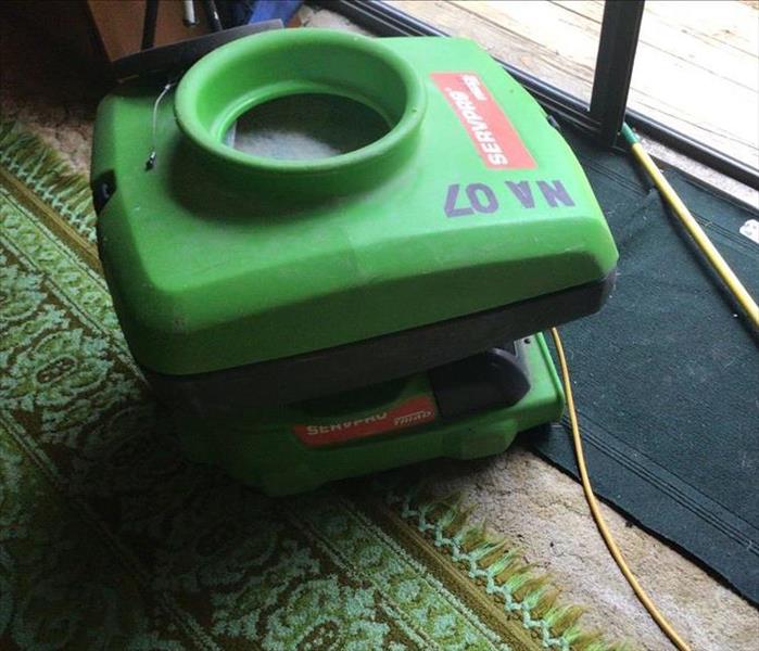 A SERVPRO air scrubber in action
