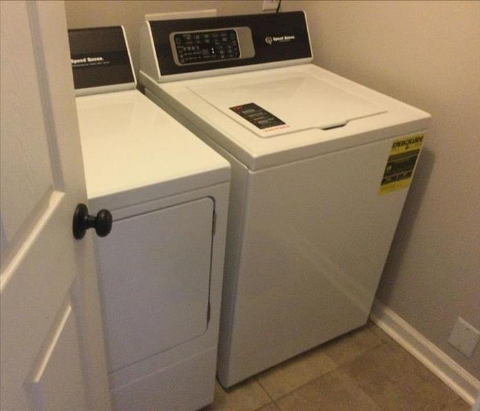 A washing machine that leaked and caused water damage to a Madison County home.