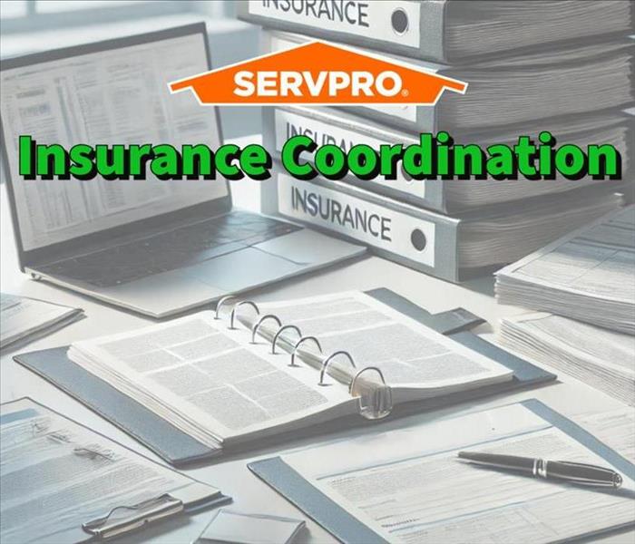 A SERVPRO professionals desk while working with insurance professionals.